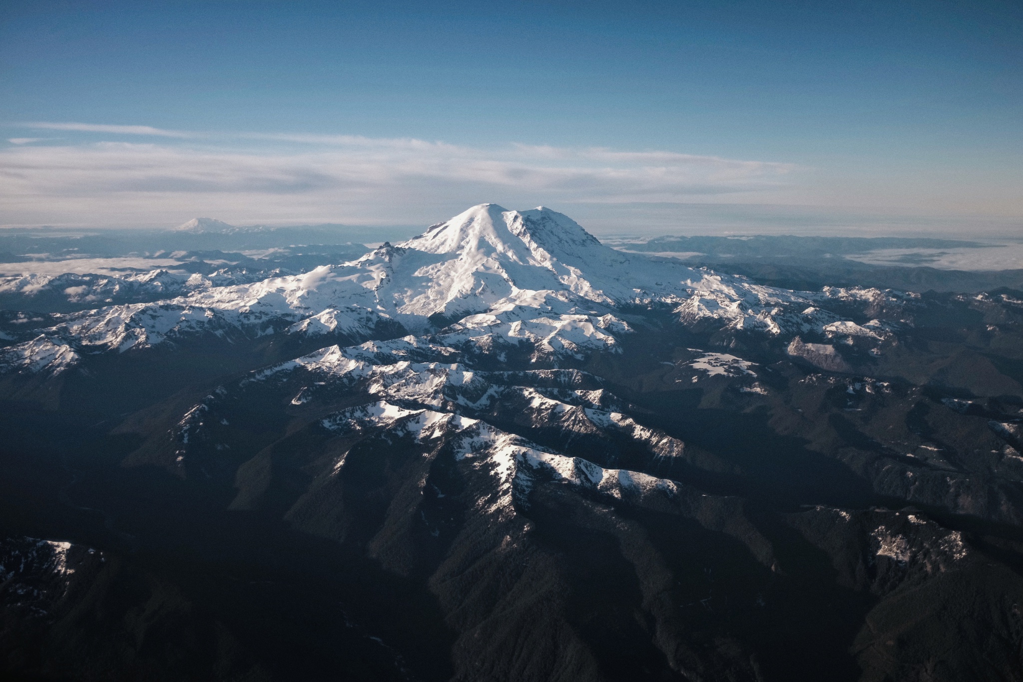 Mount Rainier in Washington, photographed from the air. At 14,410 feet, heavily glaciated summit dome